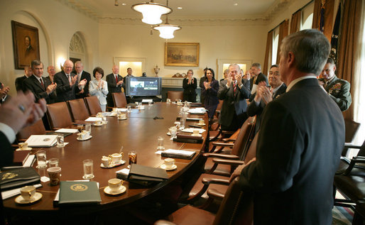 Secretary Andy Card is met by member applause Tuesday, March 28, 2006, as he enters the Cabinet Room moments after President George W. Bush announced the Chief of Staff's resignation. White House photo by David Bohrer