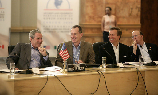 President George W. Bush is seated next to Robert J. Stevens, president and CEO of Lockheed Martin, right, during a meeting with Canadian Prime Minister Stephen Harper and Mexico's President Vicente Fox, in a roundtable discussion with U.S., Mexican and Canadian business leaders, Friday, March 31, 2006 at the Fiesta Americana Condesa Cancun Hotel. White House photo by Eric Draper