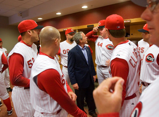 President George W. Bush talks with Reds outfielder and fellow Texan Adam Dunn during a visit with the team before throwing out the first pitch of the opening game between the Cincinnati Reds and the Chicago Cubs in Cincinnati, Ohio, Monday, April 3, 2006. White House photo by Eric Draper