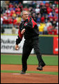 President George W. Bush winds up to throw the first pitch of the 2006 baseball season during the opening game between the Cincinnati Reds and the Chicago Cubs in Cincinnati, Ohio, Monday, April 3, 2006. White House photo by Eric Draper