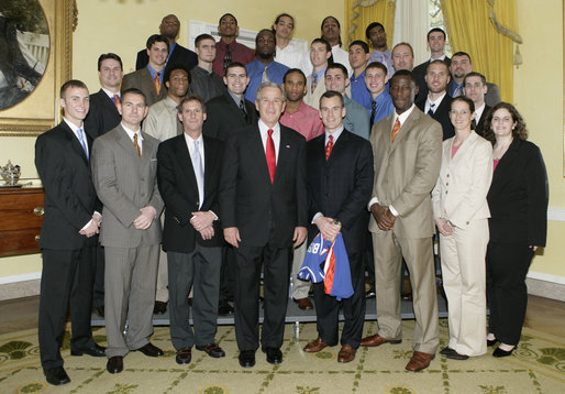President George W. Bush stands with members of the University of Florida Men’s Basketball Team Thursday, April 6, 2006, during a photo opportunity with the 2005 and 2006 NCAA Sports Champions at the White House. White House photo by Eric Draper