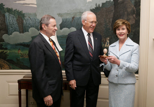Victor Mooney, American Egg Board Chairman and Louis Raffel, American Egg Board President, present Mrs. Laura Bush with an annual commemorative egg from the American Egg Board Thursday, April 6, 2006 at the White House. The egg shell has been carved to display the Presidential Seal. White House photo by Shealah Craighead