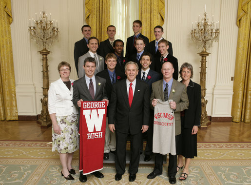 President George W. Bush stands with members of the University of Wisconsin Men’s Cross Country Team Thursday, April 6, 2006, during a photo opportunity with the 2005 and 2006 NCAA Sports Champions. White House photo by Paul Morse