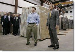 President George W. Bush tours the Europa Stone Distributors, Inc. facility in Sterling, Va., with company Vice President Adam Mahmud, Monday, April 17, 2006. Following the tour President Bush, who was joined by U.S. Treasury Secretary John Snow, U.S. Rep. Frank Wolf, R-Va., and White House Chief of Staff Josh Bolten, left, participated in a roundtable discussion on taxes and the economy.  White House photo by Paul Morse