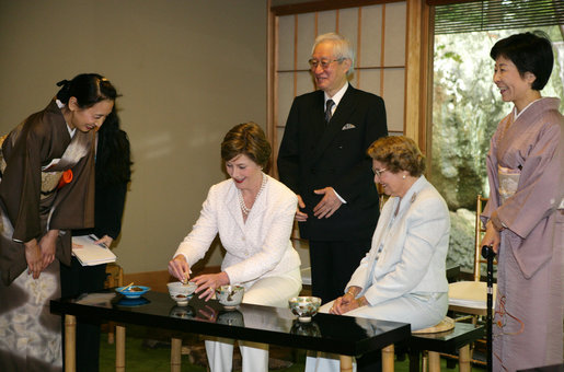 Mrs. Laura Bush, joined by her mother, Mrs. Jenna Welch, right, is given whisking instructions by Ms. Sakiko Akiyama, executive assistant to Grand Master Sen Genshitsu, left, while participating in a Japanese Tea Ceremony, Monday, April 17, 2006, in Washington, DC, with H.E. Ryozo Kato, Ambassador of Japan to the US, and his wife, Mrs. Hanayo Kato. White House photo by Shealah Craighead