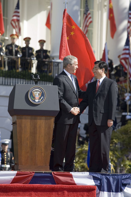 President George W. Bush shakes hands with President Hu Jintao of China after both leaders delivered remarks during a South Lawn arrival ceremony, Thursday, April 20, 2006. White House photo by Eric Draper