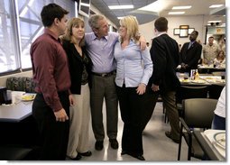 President George W. Bush spends time with Marines and their families following lunch inside the mess hall at the Marine Corps Air Ground Combat Center in Twentynine Palms, California, Sunday, April 23, 2006. White House photo by Eric Draper
