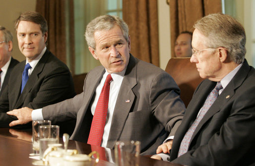 President George W. Bush places his hands on the arm of U.S. Senate Majority leader Senator Bill Frist, R-Tenn., left, and U.S. Senate Democratic leader Senator Harry Reid, D-Nev., right, at the conclusion of a meeting with legislators Tuesday, April 25, 2006 at the White House to discuss immigration reform. President Bush thanked both Republican and Democratic members of the Senate for their hard work to get a comprehensive immigration bill out of the U.S. Senate and hopefully to his desk before the end of this year. White House photo by Eric Draper