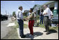 President George W. Bush greets homeowner Ethel Williams during a visit to her hurricane damaged home in the 9th Ward of New Orleans, Louisiana, Thursday, April 27, 2006. White House photo by Eric Draper