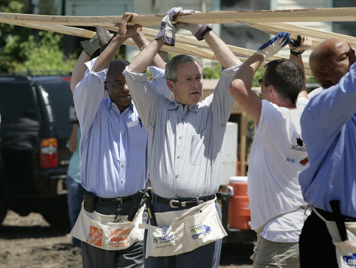 President George W. Bush helps volunteers from Operation Rebuilding Hands with the construction of a home in New Orleans, Louisiana, Thursday, April 27, 2006. Also pictured are Congressman Bill Jefferson, left, and New Orleans Mayor Ray Nagin. White House photo by Eric Draper