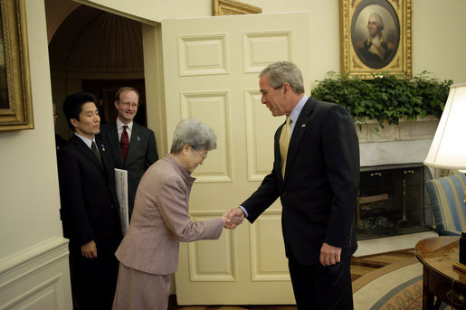 President George W. Bush welcomes Mrs. Sakie Yokota, mother of Megumi Yokota, and her son representing family members of Japanese citizens abducted by North Korea to the Oval Office Friday, April 28, 2006. "I have just had one of the most moving meetings since I've been the President here in the Oval Office. I met with a mom and a brother who long to be reunited with her daughter and his sister," said the President to the press. "They're apart because the North Korean government abducted the child when she was a teenager. And all the mom wants is to be reunited with her daughter." White House photo by Paul Morse