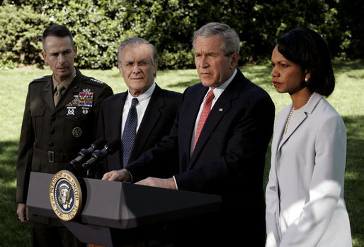 President George W. Bush makes a statement to the press regarding the recent trip to Iraq by Secretary Rumsfeld and Secretary Rice on the South Lawn May 1, 2006. The President is standing with, from left, Chairman of the Joint Chiefs of Staff Peter Pace, Defense Secretary Donald Rumsfeld and State Secretary Condoleezza Rice. White House photo by Eric Draper