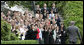 President George W. Bush is greeted by applause as he arrives on the South Lawn Wednesday, May 3, 2006, by recipients of the 2005 Presidential Awards for Excellence in Mathematics and Science Teaching. White House photo by Eric Draper