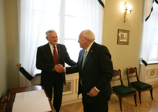 After signing the guest book at the Presidential Palace in Vilnius, Lithuania, Vice President Dick Cheney shakes hands with Lithuanian President Valdus Adamkus, Wednesday May 3, 2006. The two leaders participated in a bilateral meeting to discuss regional issues prior to the beginning of the Vilnius Conference 2006, a summit gathering heads of state from the Baltic and Black Sea regions that begins Thursday. White House photo by David Bohrer