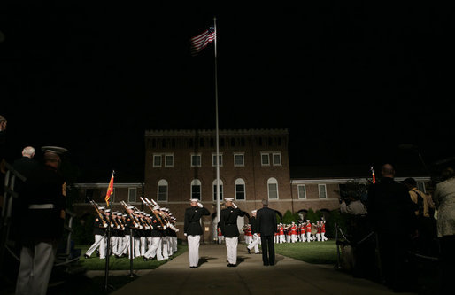 President George W. Bush stands for the March in Command Review during an Evening Parade, May 5, 2006, at the Marine Barracks in Washington, D.C. White House photo by Paul Morse