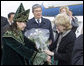 A Kazakh woman adorned in ceremonial dress welcomes Mrs. Lynne Cheney to Astana, Kazakhstan, with a bouquet of flowers, Friday, May 5, 2006. White House photo by David Bohrer