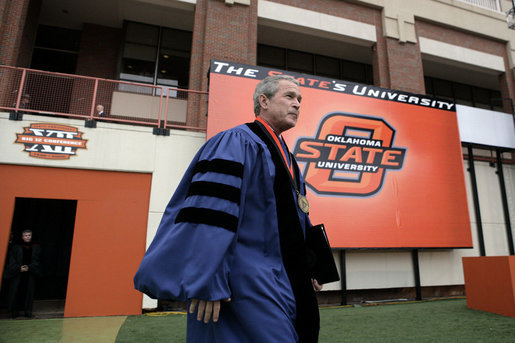 President George W. Bush walks onto the field of Boone Pickens Stadium at Oklahoma State University in Stillwater, OK where he delivered the commencement address to the class of 2006 on Saturday May 6, 2006. White House photo by Paul Morse
