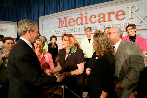 President George W. Bush greets audience members at the end of A Conversation on the Medicare Prescription Drug Benefit at the Asociacion Borinquena de Florida Central, Inc., in Orlando Wednesday, May 10, 2006. White House photo by Eric Draper