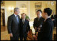 President George W. Bush meets with Chinese Human Rights activists Thursday, May 11, 2006, in the Yellow Oval Room of the White House. With the President, from left, are: Li Baiguang, Wang Yi, and Yu Jie. White House photo by Eric Draper