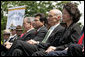 President George W. Bush sits with, from left, Attorney General Alberto Gonzales, Homeland Security Secretary Michael Chertoff and Labor Secretary Elaine Chao during the Annual Peace Officers' Memorial Service at the U. S. Capitol Monday, May 15, 2006. White House photo by Kimberlee Hewitt