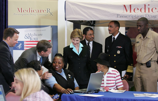 Mrs. Laura Bush meets with senior citizens during the last day of enrollment for the new Medicare prescription drug benefit at Shiloh Baptist Church in Washington, D.C., Monday, May 15, 2006. Talking with senior citizens with Mrs. Bush is Dr. Mark McClellan, Administrator, Centers of Medicare and Medicaid, and Secretary Mike Leavitt, Department of Health and Human Services. White House photo by Shealah Craighead