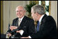 Prime Minister John Howard of Australia smiles at President Bush during their joint press conference in the East Room Tuesday, May 16, 2006. White House photo by Paul Morse