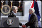 After delivering his remarks, President George W. Bush shakes hands with Australian Prime Minister John Howard during the State Arrival Ceremony held for the Prime Minister on the South Lawn Tuesday, May 16, 2006. "Freedom has enemies, and for more than a hundred years, Australians and Americans have joined together to defend freedom," said President Bush. "Together we fought the Battle of Hamel in World War I. Together we fought in World War II from the beaches of Normandy to the waters of the Coral Sea. Together we fought in Korea and Vietnam. And together we're fighting, and winning, the global war on terror." White House photo by Paul Morse