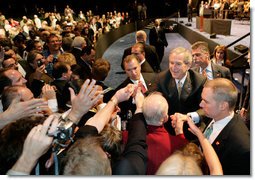 President George W. Bush greets the audience, Monday, May 22, 2006, following his remarks on the War on Terror to the National Restaurant Association gathering at Chicago's McCormick Place. White House photo by Eric Draper