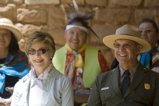 Mrs. Laura Bush and Mesa Verde National Park Superintendent Larry Wiese share a laugh, Thursday, May 23, 2006, during the celebration of the 100th anniversary of Mesa Verde and the Antiquities Act in Mesa Verde, Colorado. Also pictured are members of the Ute Mountain Ute Tribe. White House photo by Shealah Craighead
