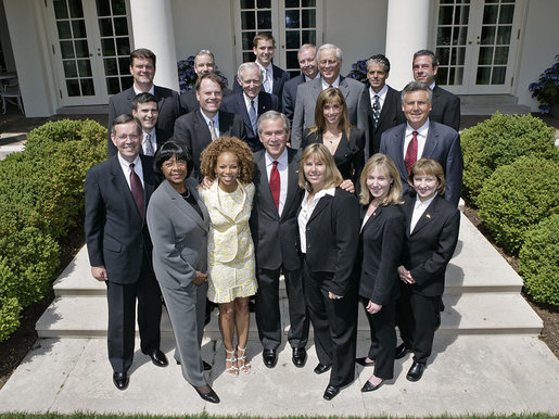 President George W. Bush stands with the President's Council on Physical Fitness and Sports in the Rose Garden Wednesday, May 24, 2006 at the White House. From left to right-front row:U.S. Secretary of Health and Human Services, Michael O. Leavitt; Dr. Lillian Green-Chamberlin; Donna Richardson Joyner; Dr. Dorothy Richardson; Melissa Johnson and Dr. Cathy Baase. Row Two: William Greer; John Burke; Charles Moore; Susan Dell and Kirk Bauer. Row Three: Tedd Mitchell; Dr. Ed Laskowski; Eli Manning; Jerry Noyce; Edgar Weldon; Paul Carrozza and Steve Bornstein. White House photo by Eric Draper