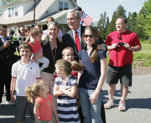 President George W. Bush poses with residents during a surprise stop in a Pottstown, Pa., neighborhood Wednesday, May 24, 2006 , after his visit to the nearby Limerick Generating Station in Limerick, Pa. White House photo by Kimberlee Hewitt