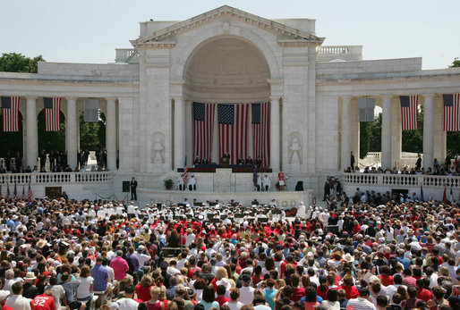 President George W. Bush addresses the thousands of people who gathered to pay their respects on Memorial Day at the Arlington National Cemetery amphitheatre in Arlington, Va., Monday, May 29, 2006. White House photo by Shealah Craighead