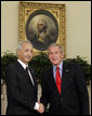 President George W. Bush exchanges handshakes with Samir Sumaidaie, Iraq's Ambassador to the United States, after receiving his credentials during an Oval Office ceremony Tuesday, May 30, 2006. Ambassador Sumaidaie is the first ambassador of a freely-elected, democratic Iraqi Government in decades. White House photo by Paul Morse