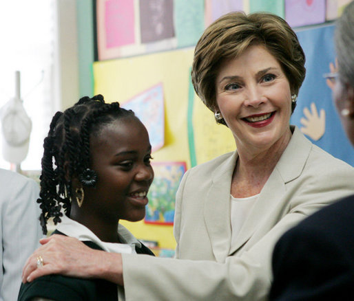 Mrs. Laura Bush congratulates Our Lady of Perpetual Help School student Rajanique White, 10, Monday, June 5, 2006, for the story Rajanique wrote and recited about a small accident that happened to her. Mrs. Bush visited the school to announce a Laura Bush Foundation for America’s Libraries grant to Our Lady of Perpetual Help. White House photo by Shealah Craighead