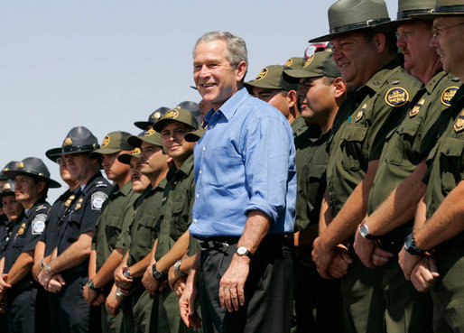 President George W. Bush joins U.S. Border Patrol agents on stage before delivering remarks on border security at the Federal Law Enforcement Training Center Artesia Facility in Artesia, New Mexico, Tuesday, June 6, 2006. White House photo by Eric Draper