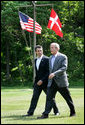 President George W. Bush walks with Prime Minister Anders Fogh Rasmussen of Denmark to their joint news conference at Camp David Friday, June 9, 2006. White House photo by Eric Draper