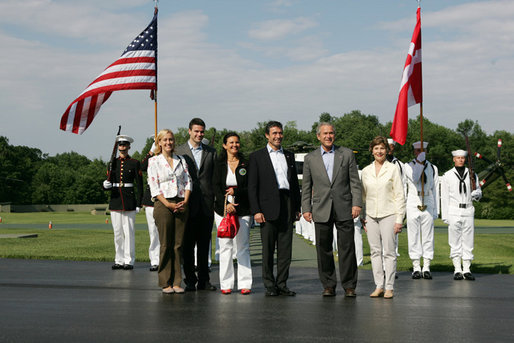 President George W. Bush and Mrs. Laura Bush welcome Prime Minister Anders Fogh Rasmussen of Denmark and his family to Camp David Friday, June 9, 2006. Pictured, from left, are the Prime Minister's daughter-in-law Kristina, son Henrik and wife Anne-Mette Rasmussen. White House photo by Shealah Craighead