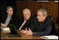 President George W. Bush gestures as he addresses his top advisors during an interagency team meeting on Iraq Monday, June 12, 2006 at Camp David, Md., part of a two-day conference on Iraq. Vice President Dick Cheney and National Security Council advisor Stephen Hadley are seen at left. White House photo by Eric Draper