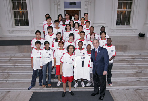 President George W. Bush stands with members of the World Cup Soccer Youth Delegation on the North Portico steps of the White House Monday, June 12, 2006. The delegation is comprised of 30 soccer players representing 13 countries. White House photo by Paul Morse