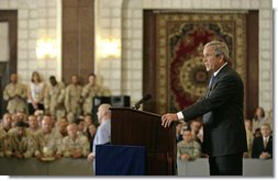 President George W. Bush speaks to U.S. troops and U.S. embassy personnel during an unannounced 5-hour trip to Baghdad, Iraq, Tuesday, June 13, 2006. "These are historic times," said the President. "The mission that you're accomplishing here in Iraq will go down in the history books as an incredibly important moment in the history of freedom and peace; an incredibly important moment of doing our duty to secure our homeland."  White House photo by Eric Draper