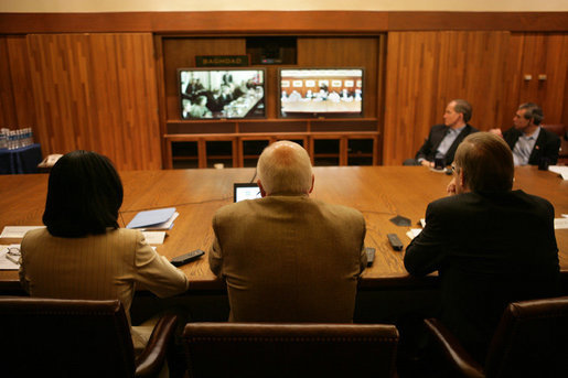 Vice President Dick Cheney, Secretary of Defense Donald Rumsfeld, right, and Secretary of State Condoleezza Rice, left, participate in a video teleconference from Camp David, Md., Tuesday, June 13, 2006 as President Bush meets Iraqi Prime Minister Nouri al-Maliki in Baghdad. The President expressed praise for Prime Minister Maliki's efforts in assembling a strong and diverse unity government in Iraq and said, "I want to thank you for giving me and my cabinet a chance to hear from you personally and a chance to meet the members of this team you've assembled. It's an impressive group of men and women, and if given the right help, I'm convinced you will succeed, and so will the world." White House photo by David Bohrer
