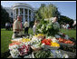 Guests look over a vegetable buffet table at the annual Congressional Picnic on the South Lawn of the White House Wednesday evening, June 15, 2006, an annual event started by former President Ronald Reagan to host members of Congress and their families. White House photo by Shealah Craighead