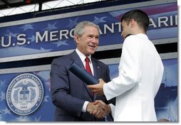 President George W. Bush greets graduates as they receive their degrees during the graduation ceremony at the United States Merchant Marine Academy at Kings Point, New York, Monday, June 19, 2006. White House photo by Kimberlee Hewitt