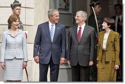 President George W. Bush, Mrs. Laura Bush, Hungarian President Laszlo Solyom and Mrs. Erzsebet Solyom participate in an official arrival ceremony at Sandor Palace in Budapest, Hungary, June 22, 2006. White House photo by Paul Morse