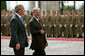 Hungarian President Laszlo Solyom and President George W. Bush review the Hungarian troops during an arrival ceremony at Sandor Palace in Budapest, Hungary, Thursday, June 22, 2006. White House photo by Shealah Craighead