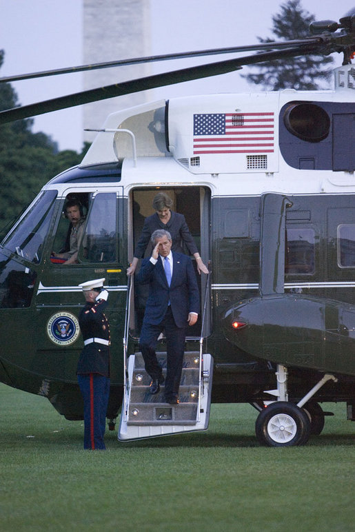 President George W. Bush and Laura Bush arrive via Marine One on the South Lawn of the White House Thursday, June 22, 2006, after a three-day European visit to Vienna and Budapest. White House photo by Kimberlee Hewitt