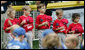 Members of the McGuire AFB Little League Yankees hold their caps over their hearts during the playing of National Anthem at the opening Tee Ball game of the 2006 season on the South Lawn of the White House, Friday, June 23, 2006. The McGuire AFB Yankees played the Dolcom Little League Indians of the Naval Submarine Base from Groton, Ct. White House photo by Eric Draper