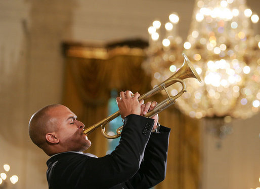 Composer and trumpeter Irvin Mayfield performs in the East Room of the White House Monday, June 26, 2006, as part of the Black Music Month celebration focusing on the music of the Gulf Coast: Blues, Jazz and Soul. White House photo by Eric Draper