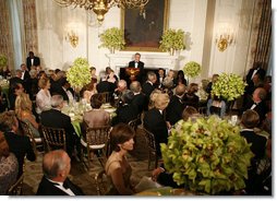 President George W. Bush addresses his welcoming remarks to invited guests Thursday evening, June 29, 2006, during an official dinner in the State Dining Room at the White House in honor of Japanese Prime Minister Junichiro Koizumi’s visit to the United States. White House photo by Paul Morse