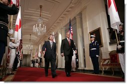 President George W. Bush and Japan’s Prime Minister Junichiro Koizumi walk through Cross Hall on their way to a joint press availability Thursday, June 29, 2006, in the East Room of the White House. White House photo by Paul Morse